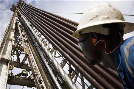 A worker is seen at an oil exploration site in Bulisa district, approximately 244 km (152 miles) northwest of Kampala in this undated handout photo from Tullow Oil Uganda, received by Reuters July 4, 2012. Photo: Tullow Oil Uganda/Handout