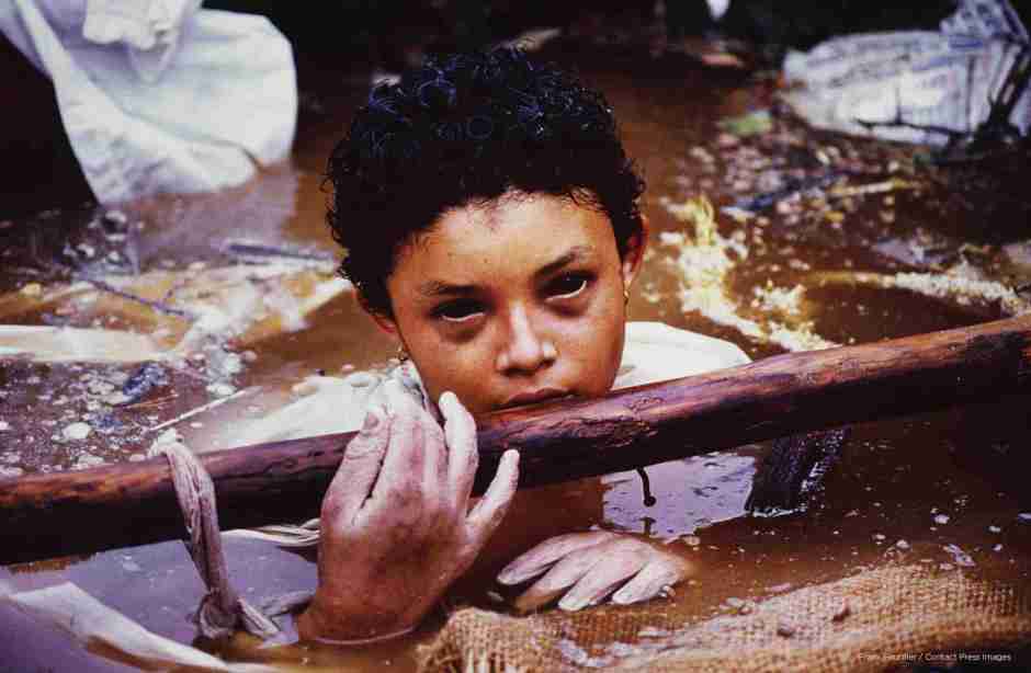 Omayra SÃ¡nchez was one of the 25,000 victims of the Nevado del Ruiz (Colombia) volcano which erupted on November 14, 1985. The 13-year old had been trapped in water and concrete for 3 days. The picture was taken shortly before she died and it caused controversy due to the photographer’s work and the Colombian government’s inaction in the midst of the tragedy, when it was published worldwide after the young girl’s death. Photographer Frank Fournier