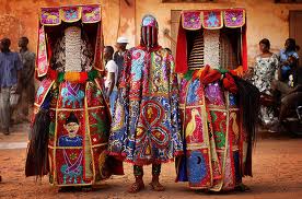 Nigerian Yaruba dressed as voodoo spirits perform during a voodoo ceremony in Ouidah, Benin. Each spirit represents the reincarnation of a dead member of the Nigerian Nagu clan. Photograph: Dan Kitwood/Getty Images