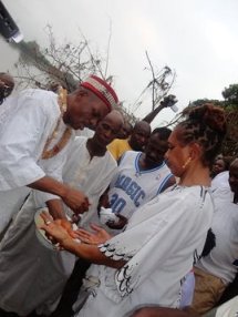 Eze Chukwuemeka Eri of Aguleri in Anambra State, Nigeria washes the hands of one of the participants. Picture courtesy of Dr. Sidney Davis