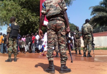 Central African security forces stand with their weapons during a demonstration for peace at a street in Bangui November 22, 2013. The landlocked nation of 4.6 million people has slid into anarchy since the mostly Muslim Seleka fighters seized the capital Bangui in March, ousting President Francois Bozize and unleashing a wave of tit-for-tat violence.  REUTERS