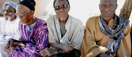 Four former lepers sit on a bench in Mballing, renamed by the authorities as a village of social rehabilitation in Senegal, on January 20 2014. Authorities began grouping leprosy patients in villages such as Mballing by fear of contagion. SEYLLOU DIALLO | AFP  