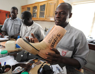 Rene Badji makes shoes for victims of leprosy.