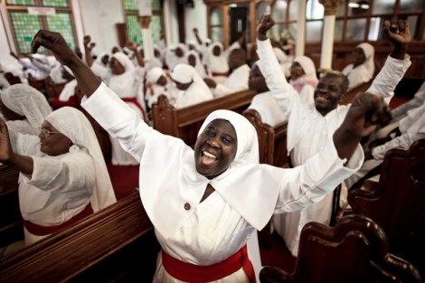 A woman in a branch of the Brotherhood of the Cross and Star in the United Kingdom exclaims in excitement. Image by Ciril Jazbec 