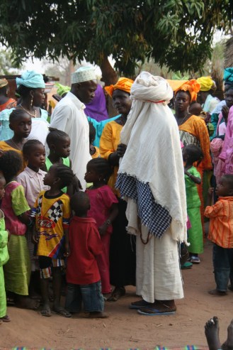 A fulani wedding in Senegal with the bride covered in white