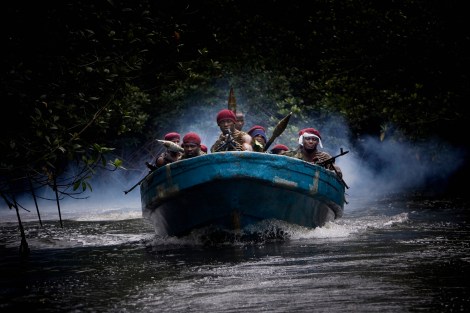 NIGER DELTA, NIGERIA-JULY 2009-Atteke Tom boys are arriving to their camp 9 hidden in the mangrove (Photo by Veronique de Viguerie/ Getty Images)