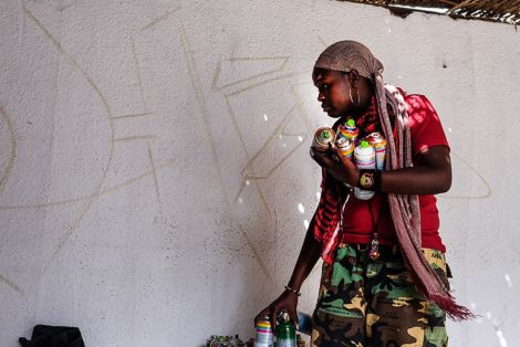 Dieynaba sketching out her painting at the Africulturban Centre in Pikine. (Photo: Ricci Shryock/ONE)