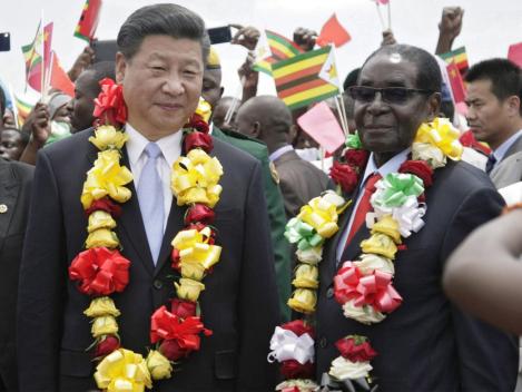 hinese President Xi Jinping was greeted by Robert Mugabe in Harare EPA
