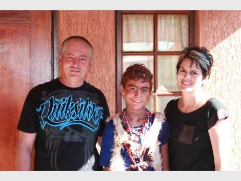 Kyle Todd (11), a mlungu sangoma (white traditional healer), together with his parents Michael and Chantal.