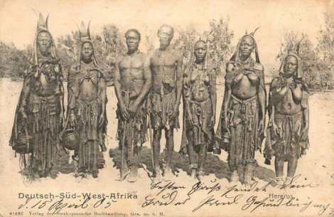 A historic postcard features Herero men and women 