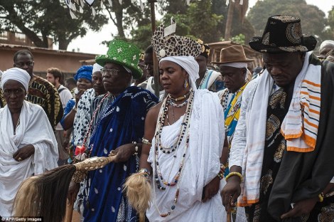 King Daagbo Hounon (centre left), Chief of the Voodoo religion in Ouidah, walks through the streets during the annual Voodoo Day celebration on January 10, which had a very political tone this year. AFP/Getty Images