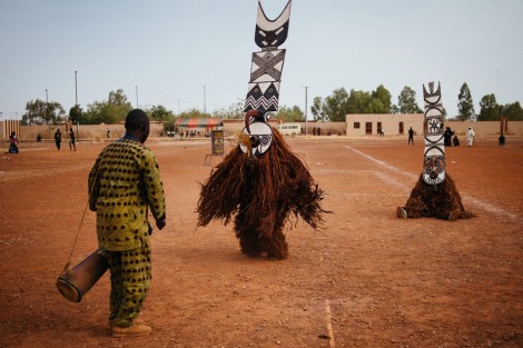 Fiber masks from Boni village (Burkina Faso) perform in the Regional Stadium of Dedougou. Music is essential, played with traditional African nstruments, accompanies very ritual and ceremony. Photo by Jacob Balzani Loov