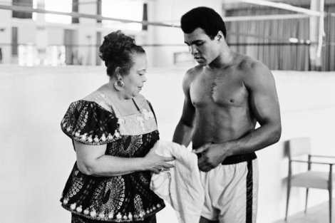 In this photo taken on October 27, 1974 US boxing heavyweight champion Muhammad Ali (born Cassius Clay) stands with her mother Odetta Lee Clay during a training session three days before the heavy weight world championship in Kinshasa. On October 30, 1974 Muhammad Ali knocked out George Foreman in a clash of titans known as the "Rumble in the Jungle", watched by 60 000 people in the stadium in Kinshasa and millions elsewhere. AFP/Getty Images