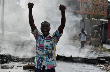 Protesters, like this man in Nairobi's Kibera slum, have been calling for a change of leadership at the electoral commission in riots which left three dead on 23 May Carl de Souza/AFP